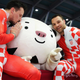 Croatian bobsledders Drazen Silic, left, and Benedikt Nikpalj pose with 2018 Winter Olympic mascot Soohorang, a white tiger.
